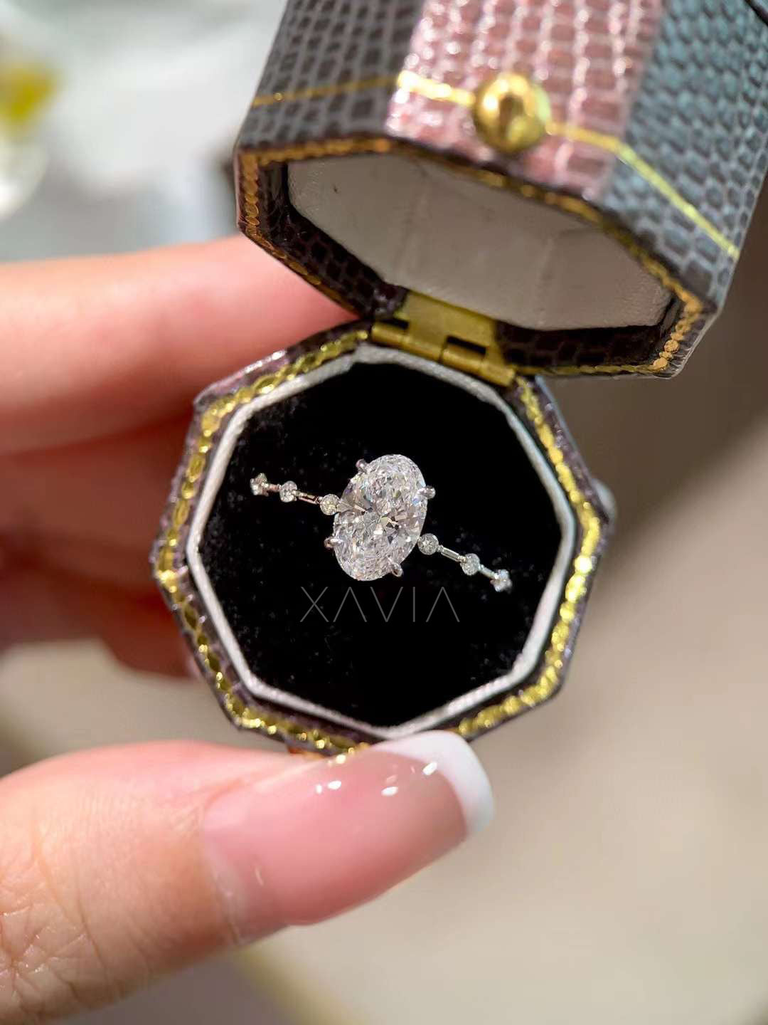 close profile view showing prongs and band details of oval cut lab diamond ring with minimalist side stones